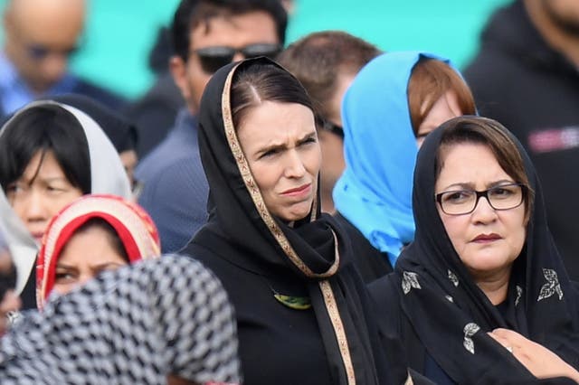 New Zealand Prime Minister Jacinda Ardern looks on as she attends Islamic prayers in Hagley Park near Al Noor mosque