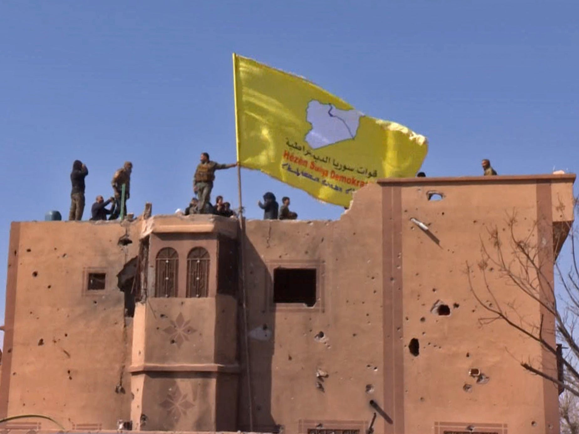 US-backed SDF flag is raised in the eastern Syrian village of Baghuz – Isis’s last stronghold