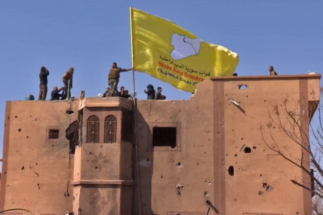 US-backed SDF flag is raised in the eastern Syrian village of Baghuz – Isis’s last stronghold