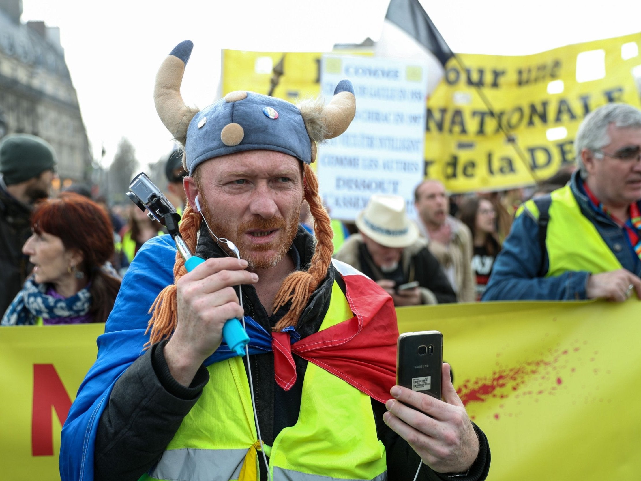A Yellow Vest protester dressed as a Gaul takes part in an anti-government demonstration called by the 'Yellow Vest' (gilets jaunes) movement in Paris, on March 23, 2019. Demonstrators hit French city streets again on March 23 for the 19th consecutive week of nationwide protest against the French President's policies and his top-down style of governing, high cost of living, government tax reforms and for more "social and economic justice."