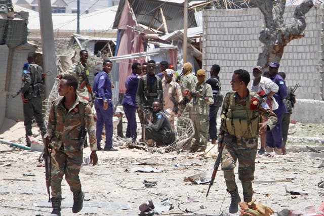 Somali government soldiers take positions during the gun battle with al-Shabaab fighters in Mogadishu