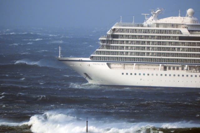 The cruise ship Viking Sky lays at anchor in heavy seas, after it sent out a Mayday signal because of engine failure in windy conditions