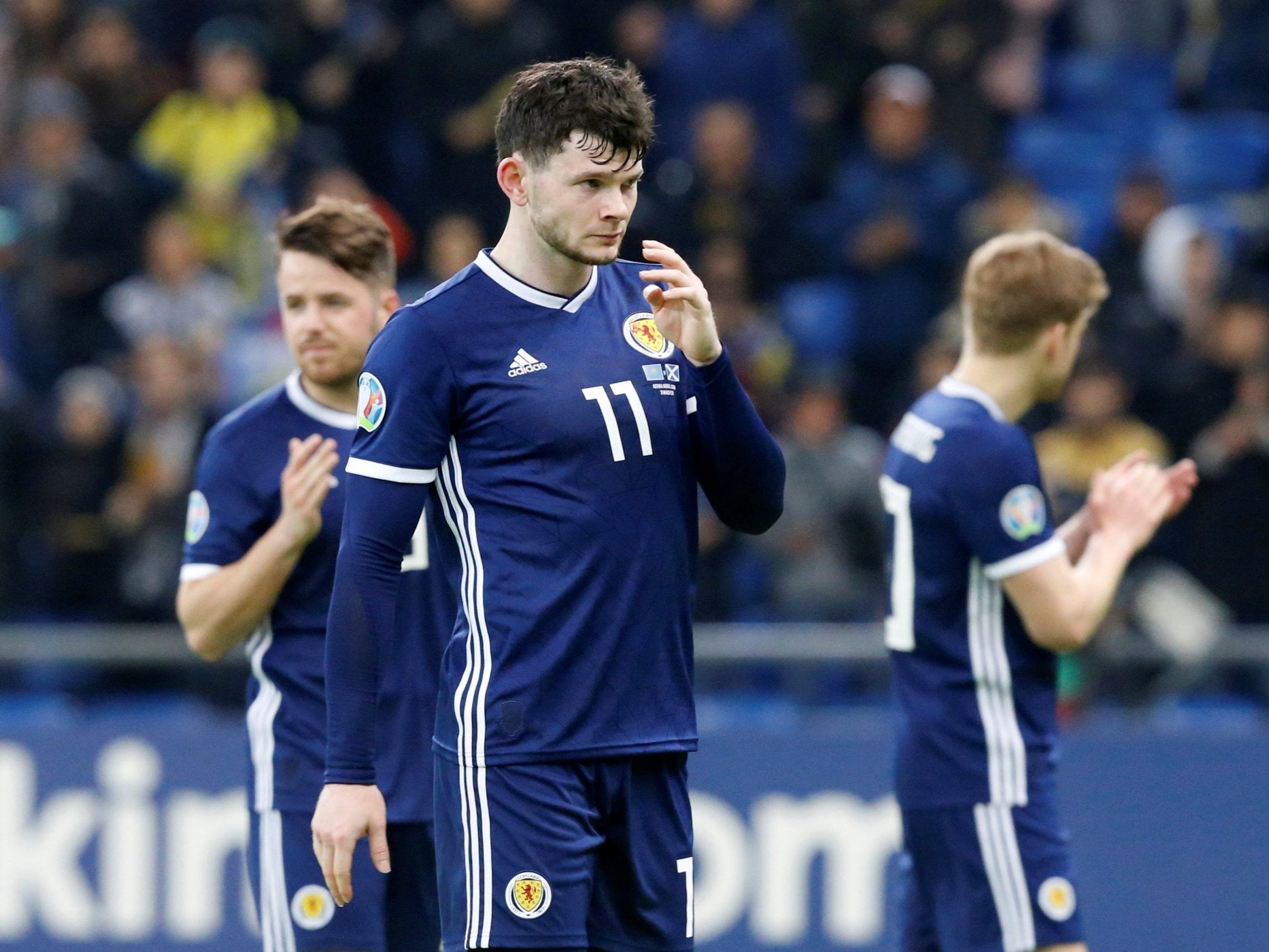 Oliver Burke cuts a dejected figure at full-time in Kazakhstan