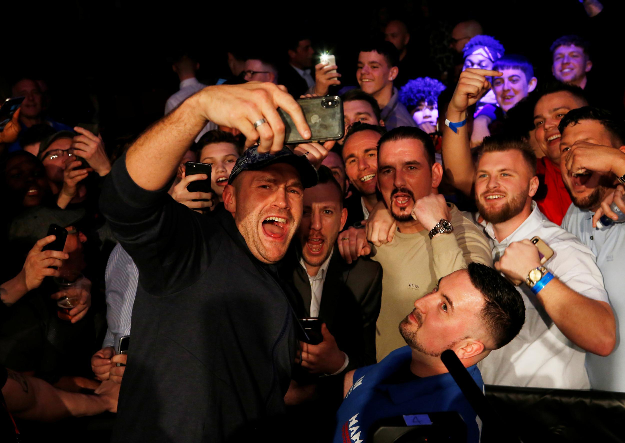 Fury enjoyed himself as he watched younger brother Tommy win again (Action Images)