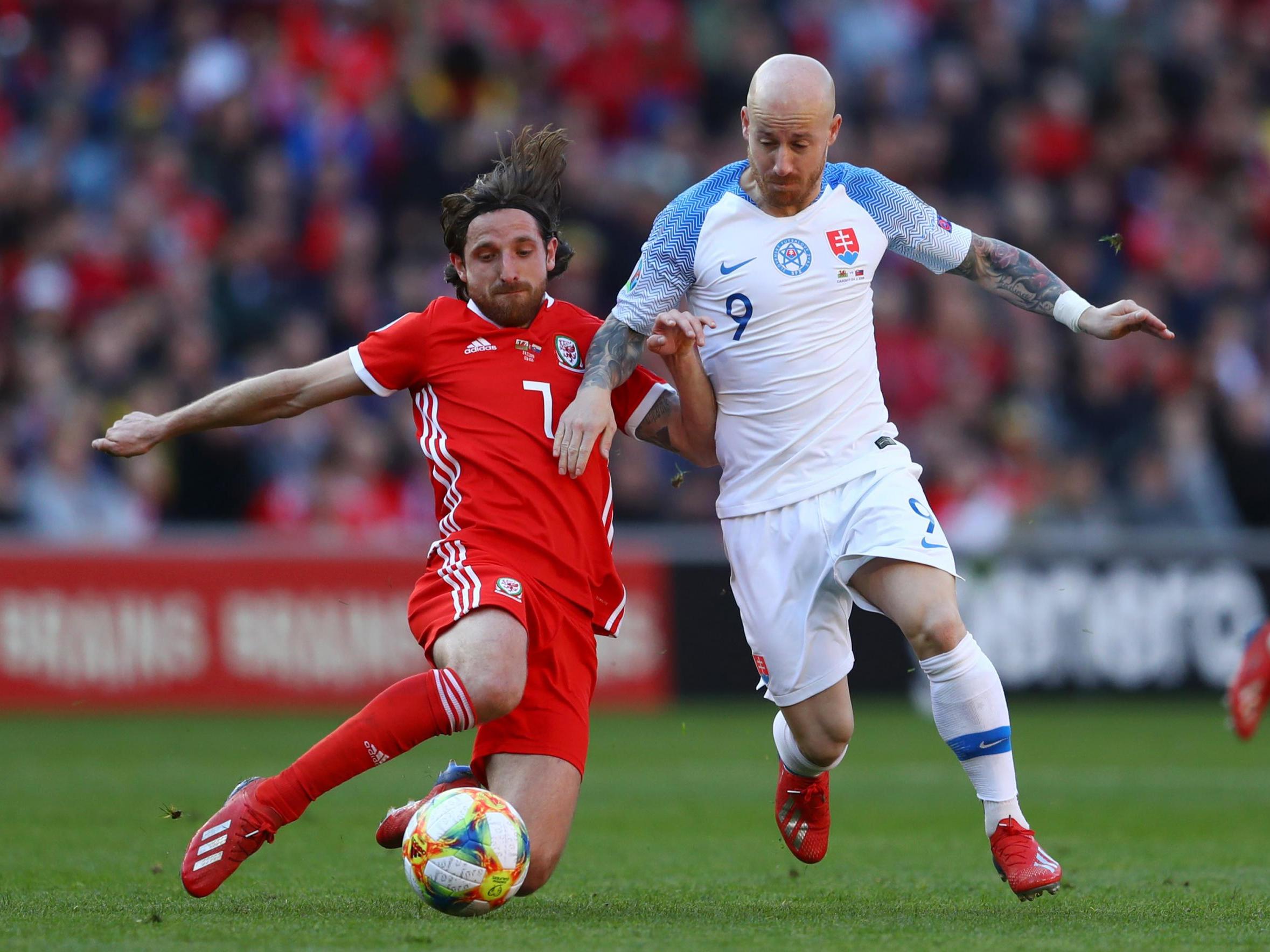 Joe Allen puts in a challenge on Miroslav Stoch