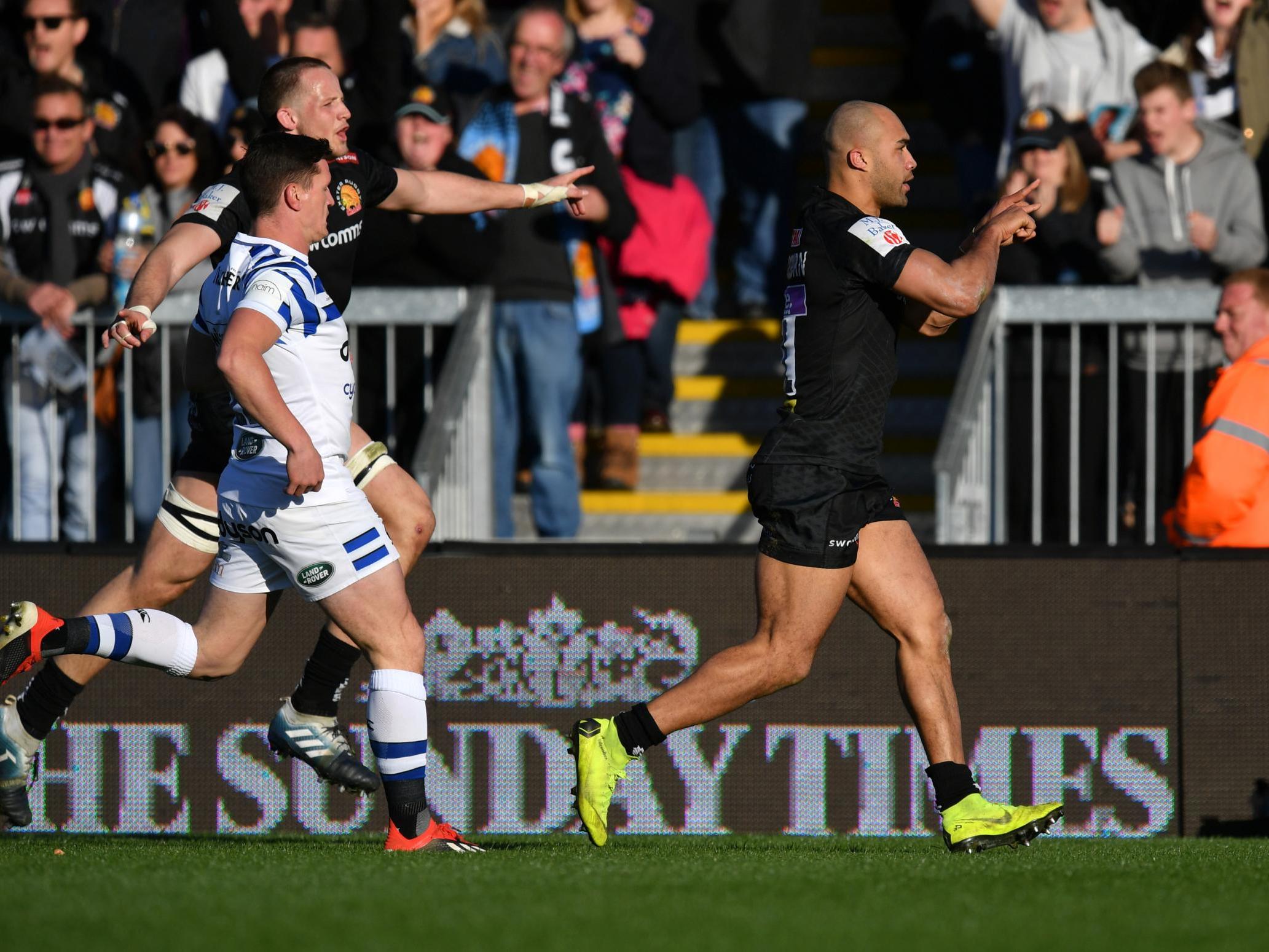 Olly Woodburn celebrates after scoring Exeter's third try of the match