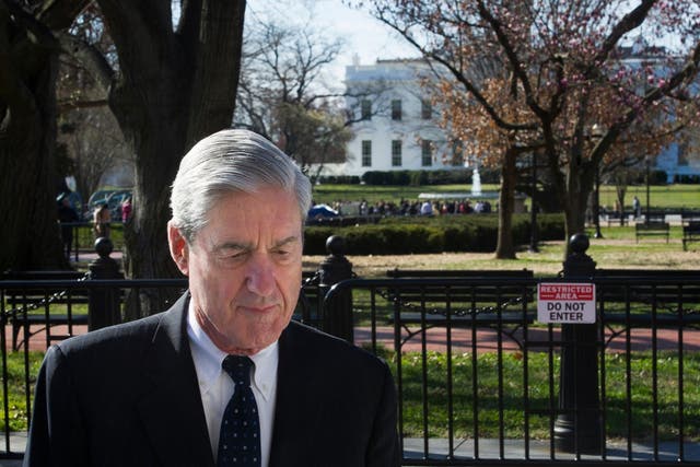 Robert Mueller walks past the White House