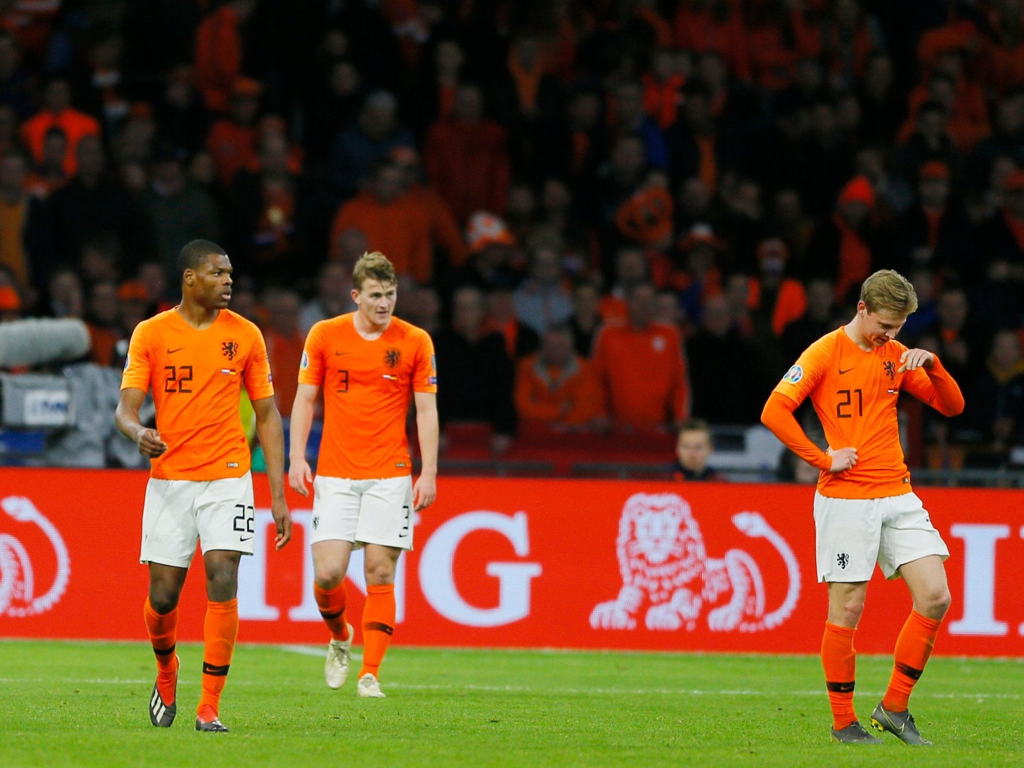 Denzel Dumfries, Matthijs De Ligt and Frenkie de Jong look dejected after Germany's late winner