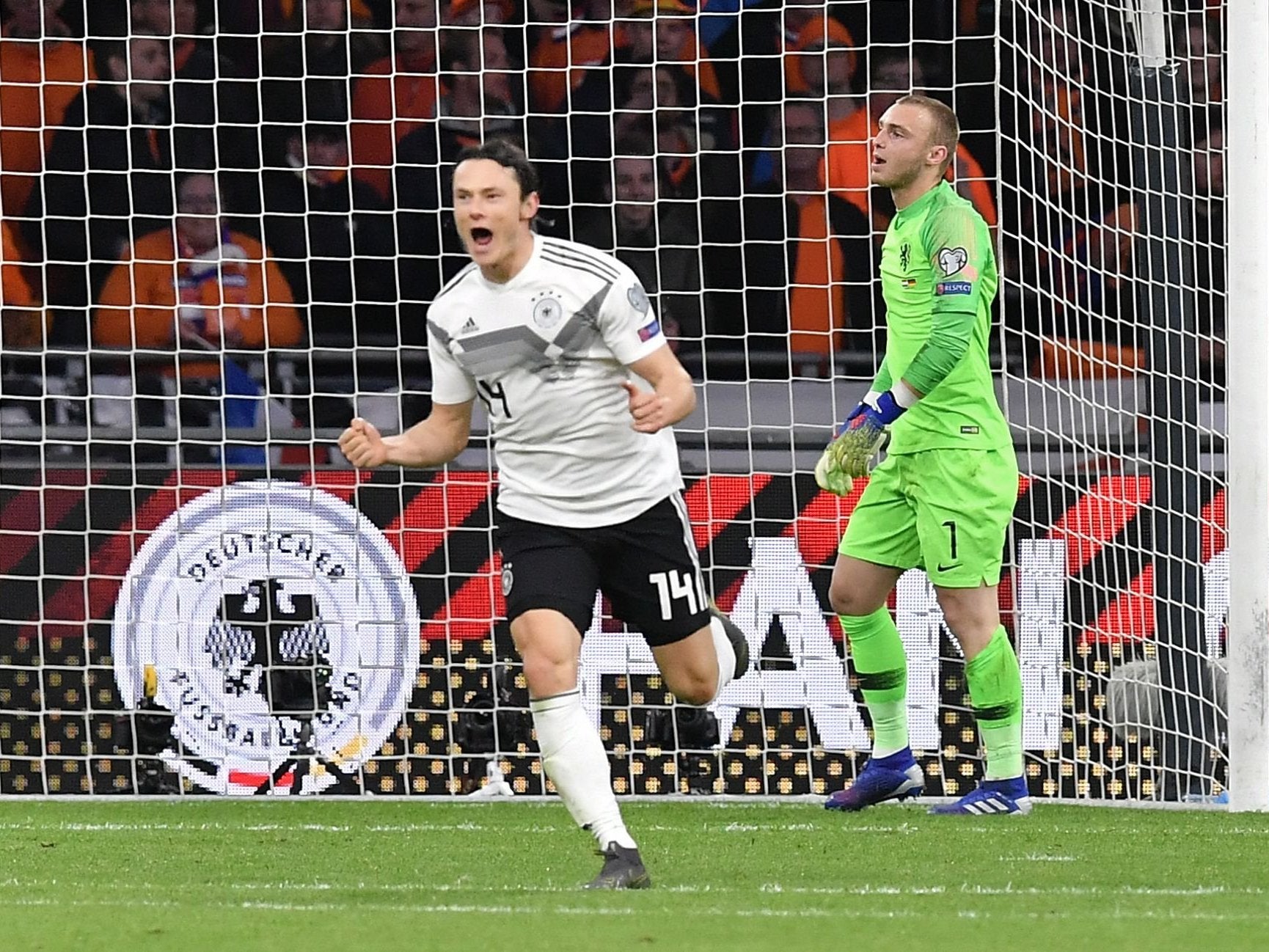 Nico Schulz celebrates his last-minute winner for Germany against the Netherlands