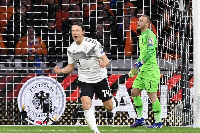 Nico Schulz celebrates his last-minute winner for Germany against the Netherlands