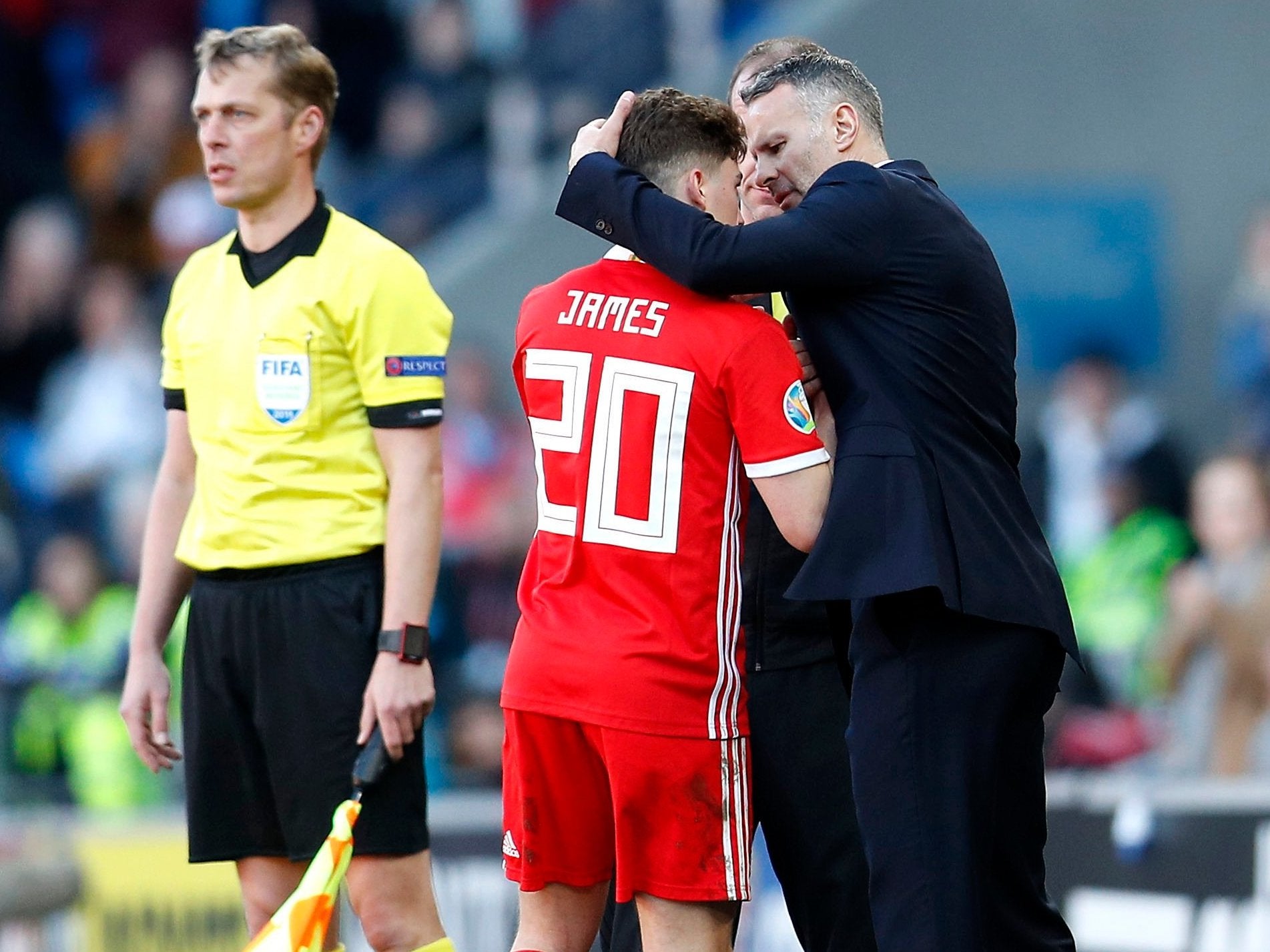 Ryan Giggs embraces Daniel James after scoring Wales' winner over Slovakia
