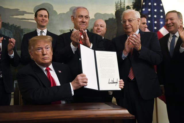 Mr Trump handed to Benjamin Netanyahu the pen he used to formally recognise Israeli sovereignty over the Golan Heights