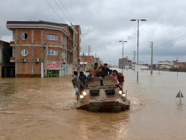 A military boat rescues people in the city of Aq Qala yesterday