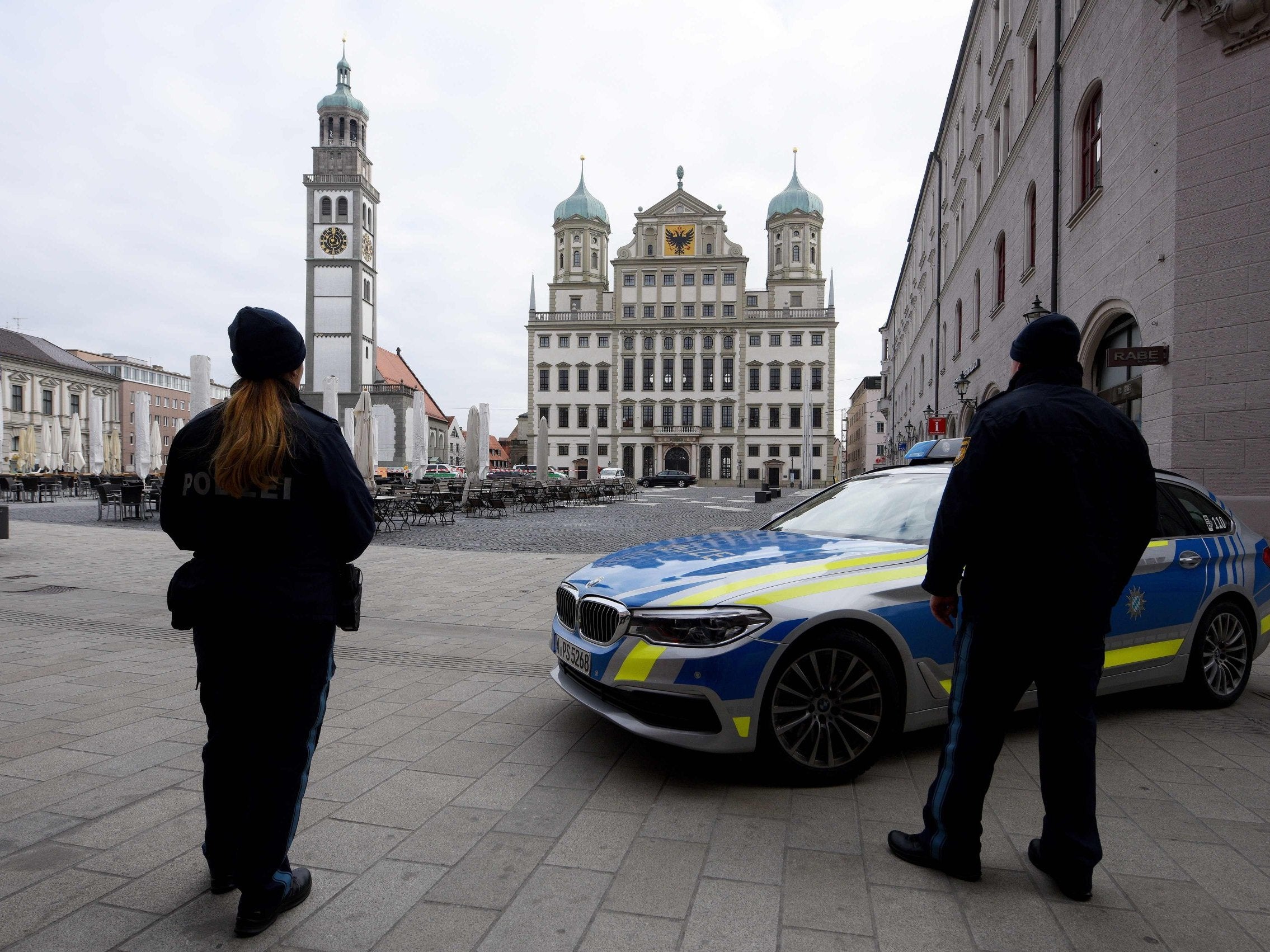 Policemen secure the square in front of the city hall of Augsburg, southern Germany