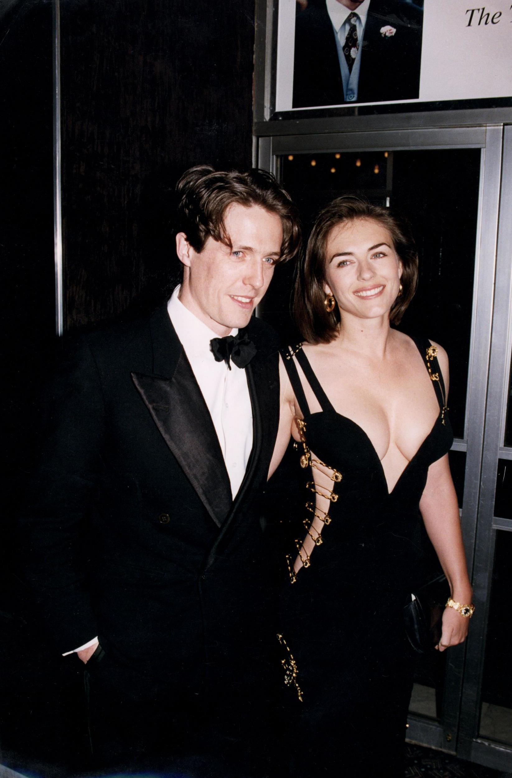 Elizabeth Hurley with then-boyfriend Hugh Grant at the premiere of Four Weddings and a Funeral in 1994