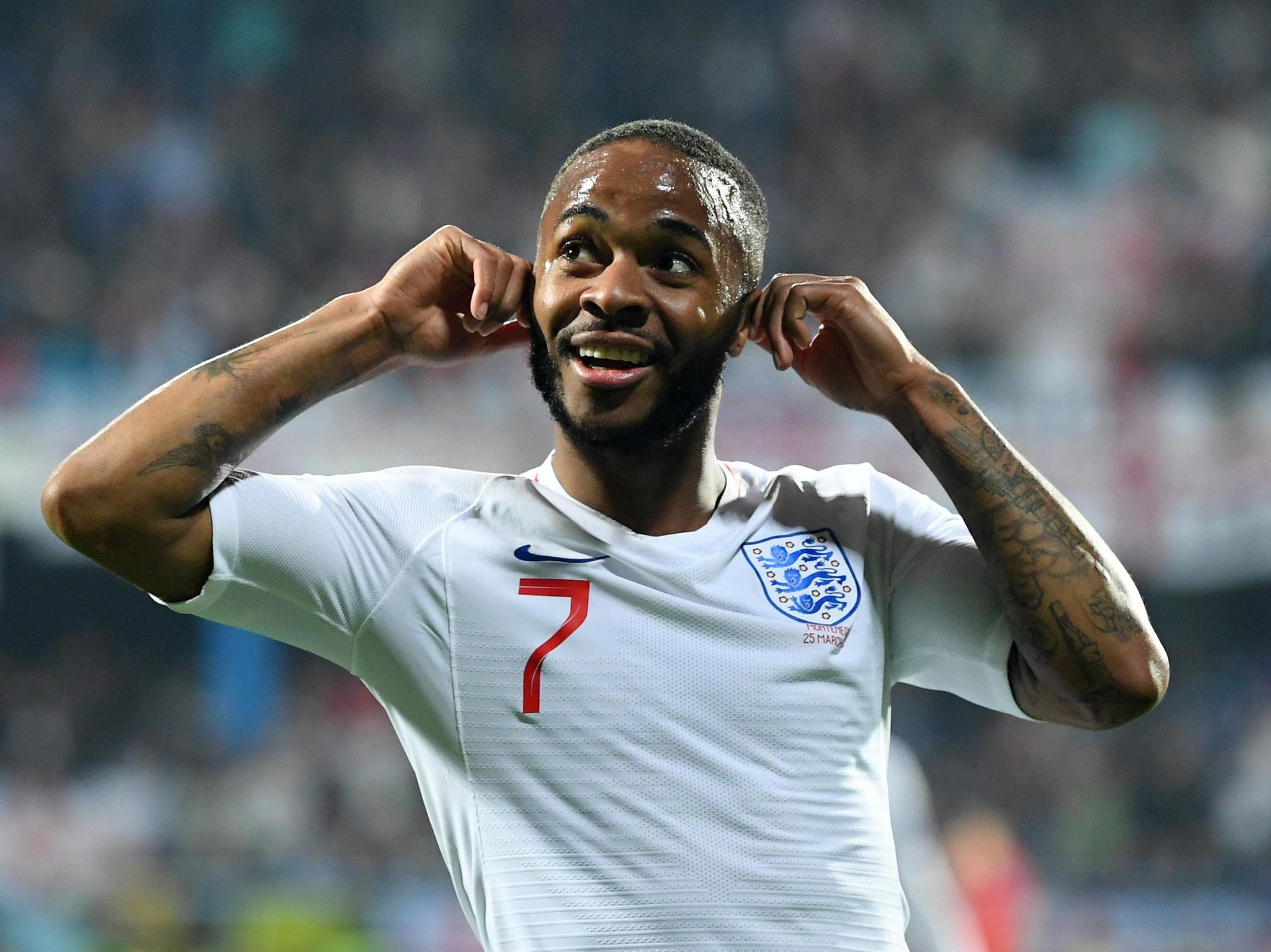 Raheem Sterling taunts the Montenegro fans