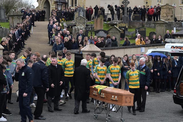 Edendork football team members beside the coffin at the funeral of Connor Currie, 16