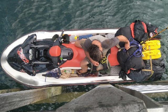 A 57-year-old British man wanted by police was arrested after allegedly trying to flee Australia on a jet ski.