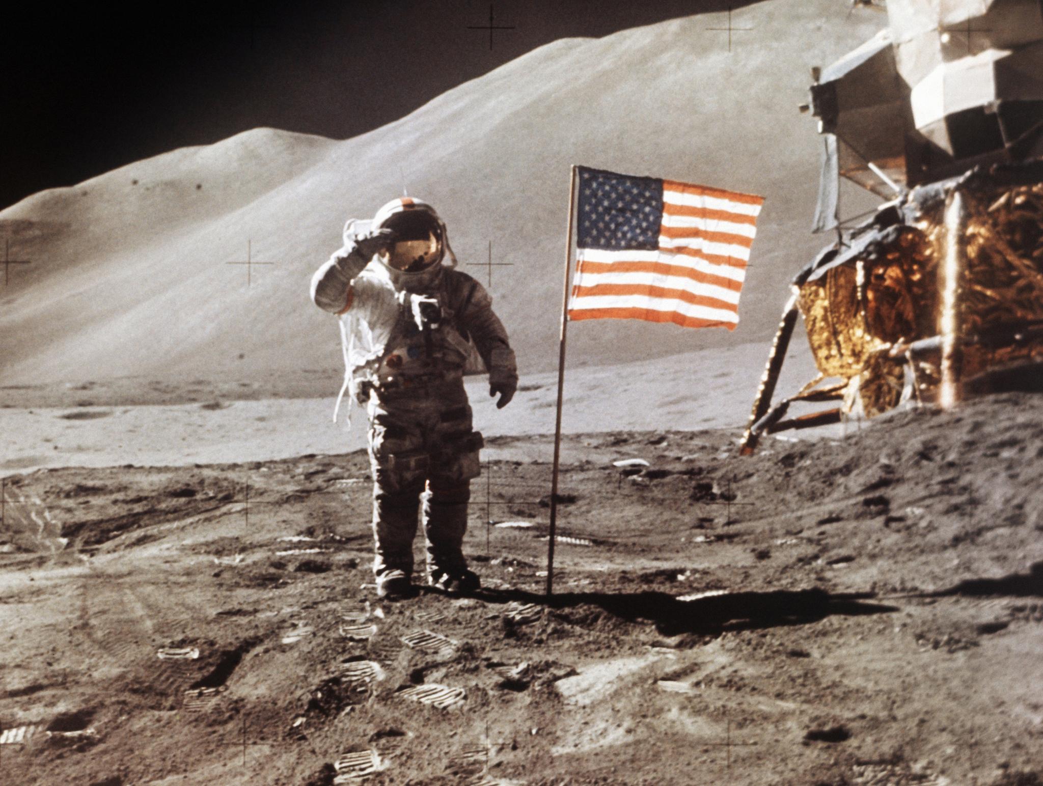 In this July 30, 1971 photo made available by NASA, Apollo 15 Lunar Module Pilot James B. Irwin salutes while standing beside the fourth American flag planted on the surface of the moon