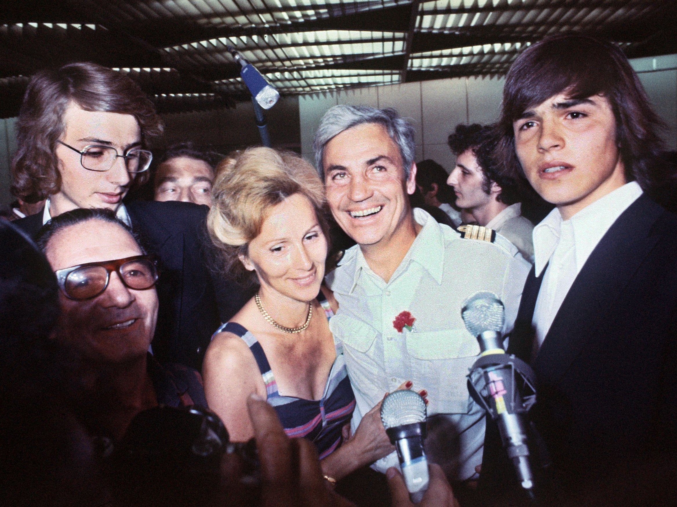 Air France captain Michel Bacos is welcomed by his wife at Orly airport, outside Paris