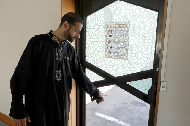 Al Noor mosque volunteer Khaled Alnobani explains his escape through a glass door panel when a gunman burst into the mosque