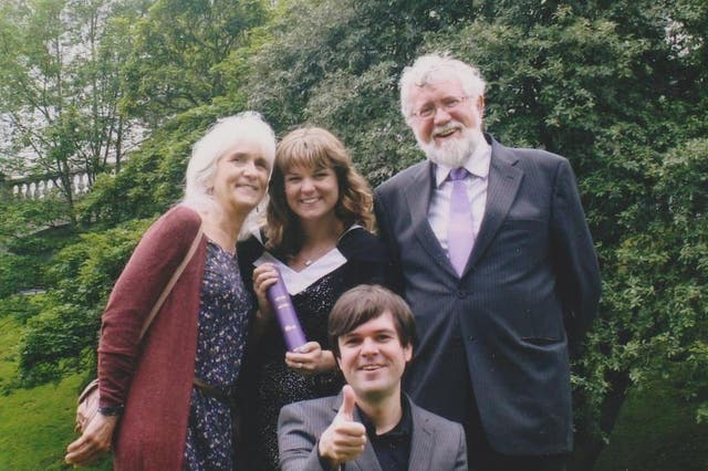 Jo Cameron (left) with her husband Jim (right) and family, feels virtually no pain because of a rare genetic mutation