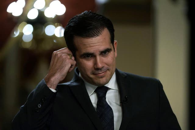 Puerto Rican Gov. Ricardo Rossello is interviewed by a TV channel after a House vote at the Capitol December 21, 2017 in Washington, DC. T
