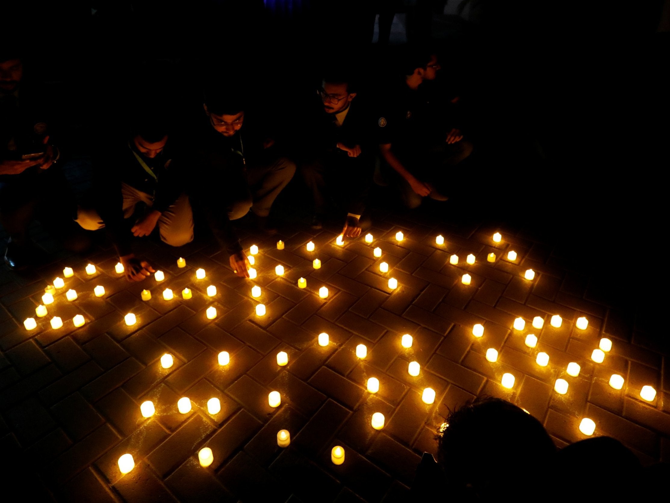 People light candles during Earth Hour in Pakistan