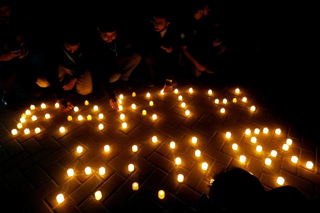 People light candles during Earth Hour in Pakistan