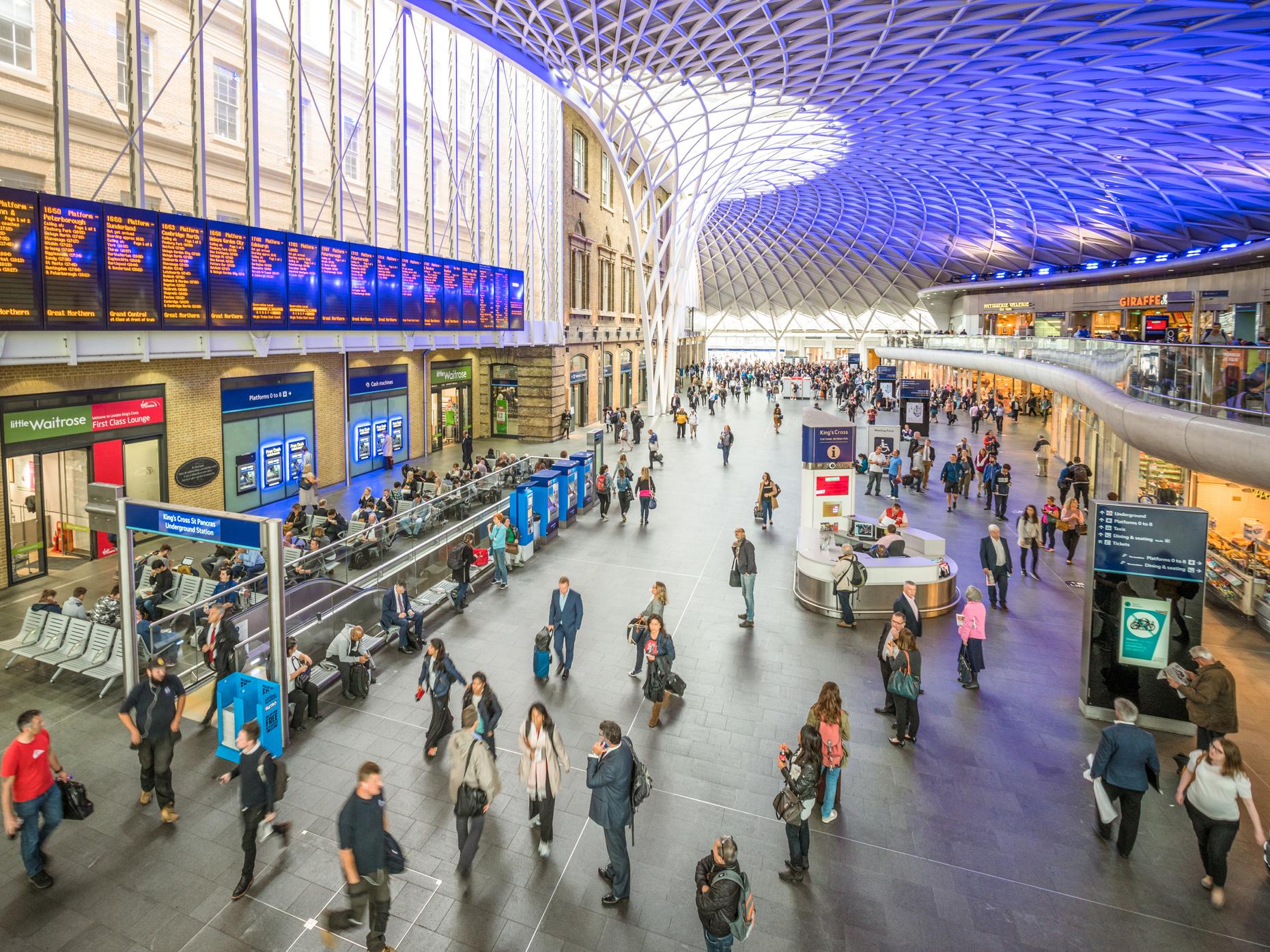 High angle view of passengers in the main hall of King's Cross Train Station, one of Central London's busiest stations