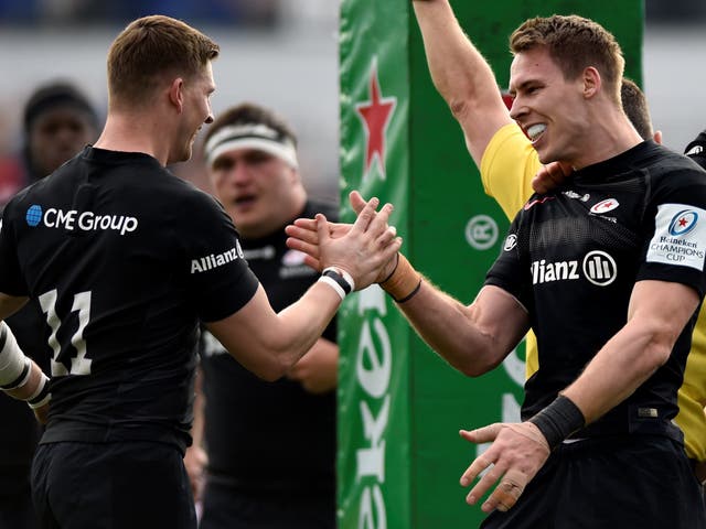 Liam Williams celebrates with David Strettle after scoring for Saracens against Glasgow