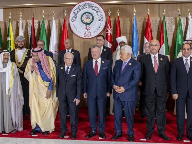 Leaders pose for a family photo ahead of the opening session within the 30th Arab League Summit in Tunis, Tunisia