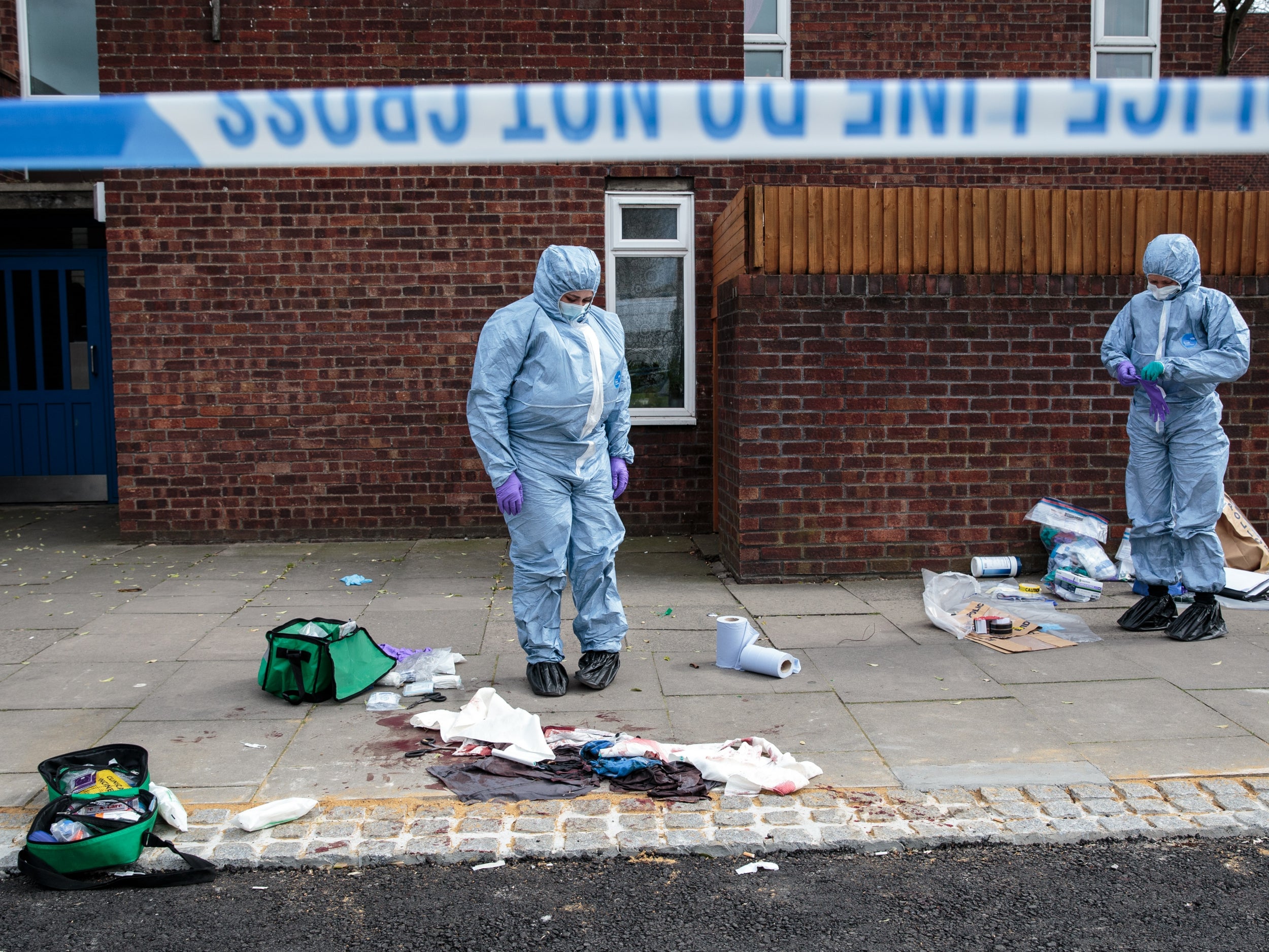 Forensics teams work at the scene of a stabbing in Edmonton (Getty Images)