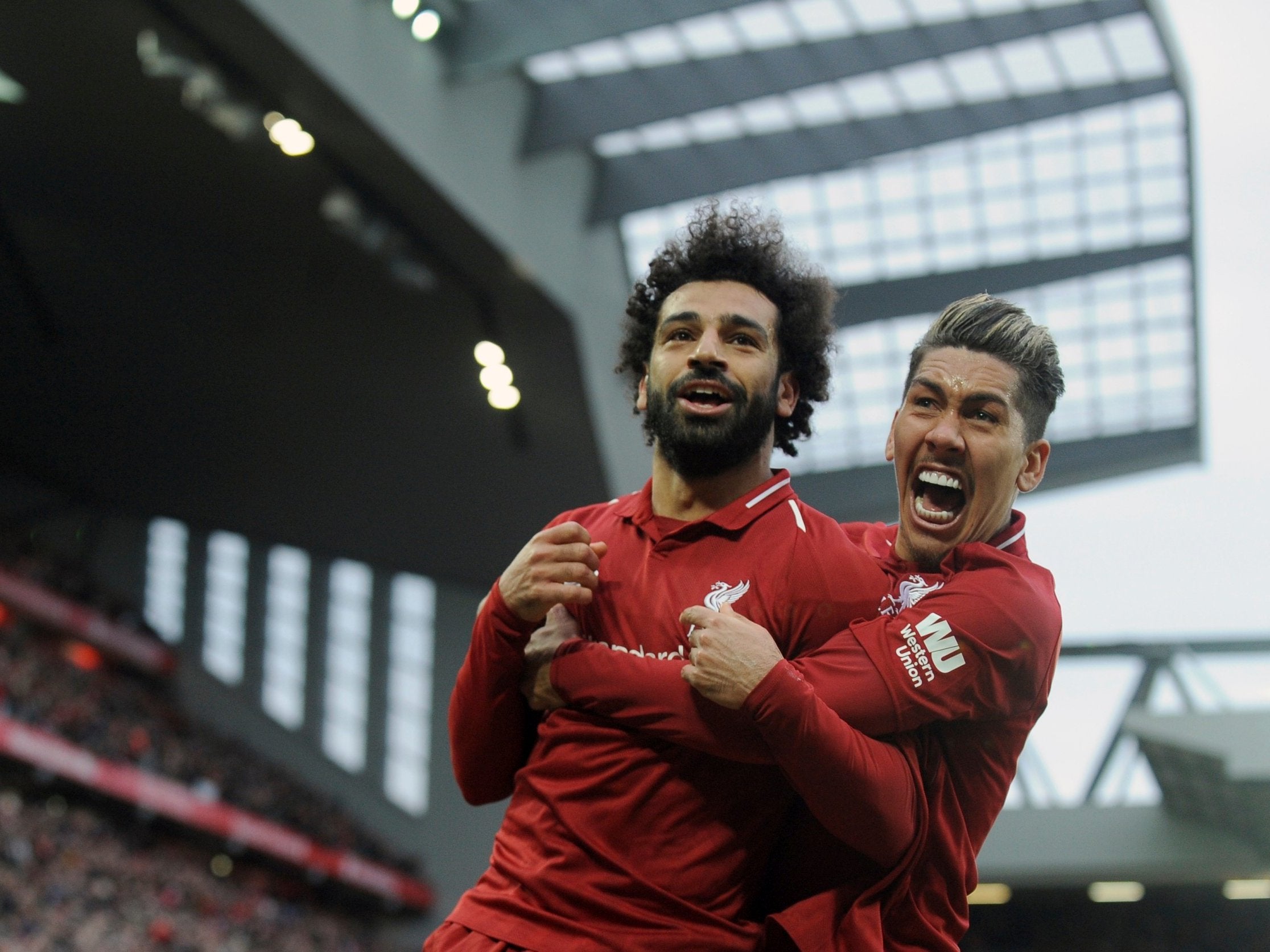 Mohamed Salah celebrates with Roberto Firmino