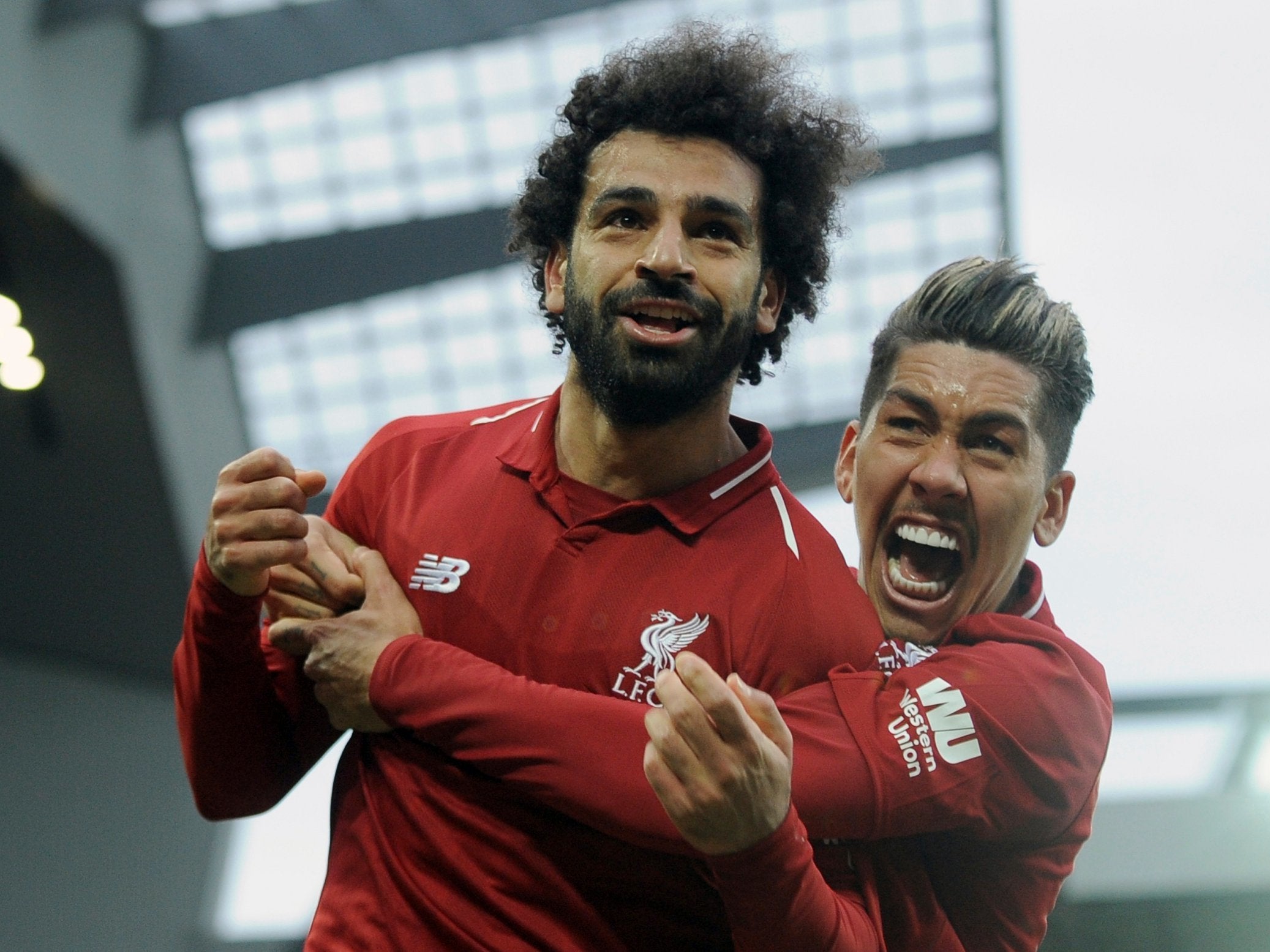 Liverpool's Mohamed Salah and Roberto Firmino celebrate