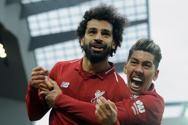 Liverpool's Mohamed Salah and Roberto Firmino celebrate