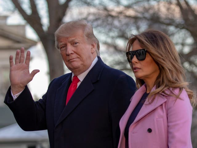 US president Donald Trump and first lady Melania Trump walk off Marine One on the South Lawn of the White House in Washington, DC