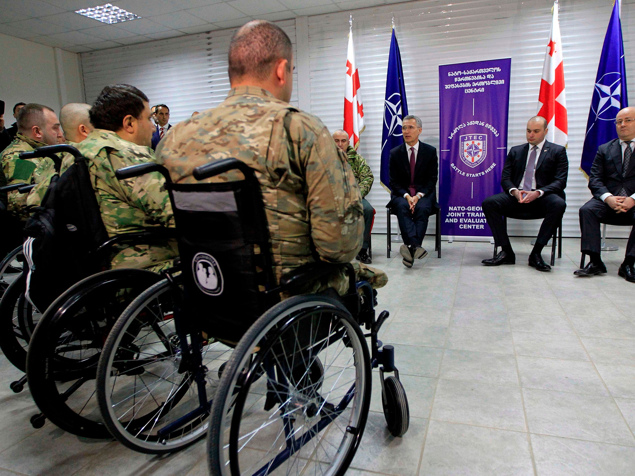 Nato secretary general Jens Stoltenberg meets Georgian soldiers in March (AFP/Getty)