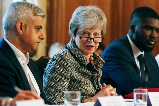 Sadiq Khan, Theresa May and Youth Justice Board co-chair Roy Sefa-Attakora at a knife crime summit in Downing Street on 1 April