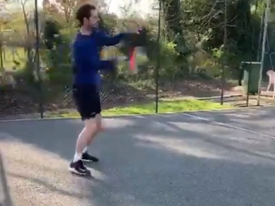 Andy Murray hits against a wall