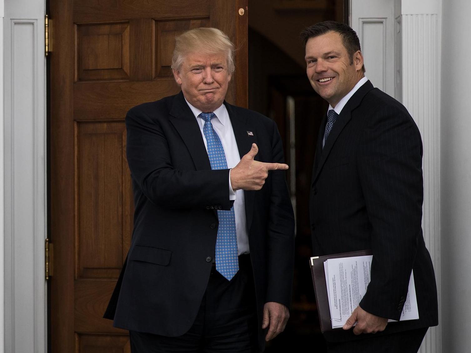 President-elect Donald Trump and Kris Kobach, Kansas secretary of state, pose for a photo following their meeting with president-elect at Trump International Golf Club, November 20, 2016 in Bedminster Township, New Jersey.