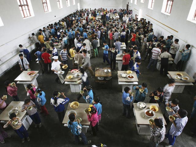 Students eat lunch in a dining hall in Chongqing Municipality, 2006