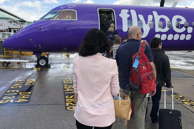 Going places? Passengers boarding a Flybe flight from Manchester to Edinburgh