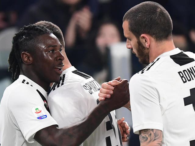 Juventus' Moise Kean celebrates with Leonardo Bonucci