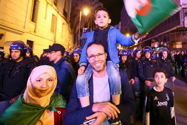 Algerians celebrate after the resignation Tuesday night of Algerian president Abdelaziz Bouteflika