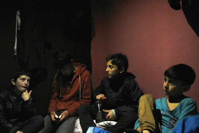 A group of unaccompanied child asylum seekers from Afghanistan at The Jungle migrant camp in Calais