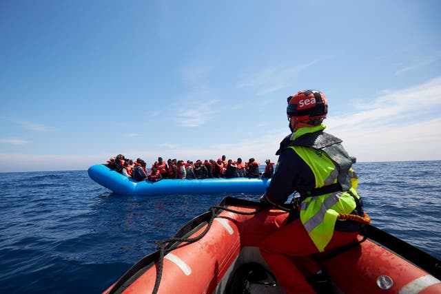 Refugees on a rubber dinghy are rescued by Sea Watch in the waters off Libya
