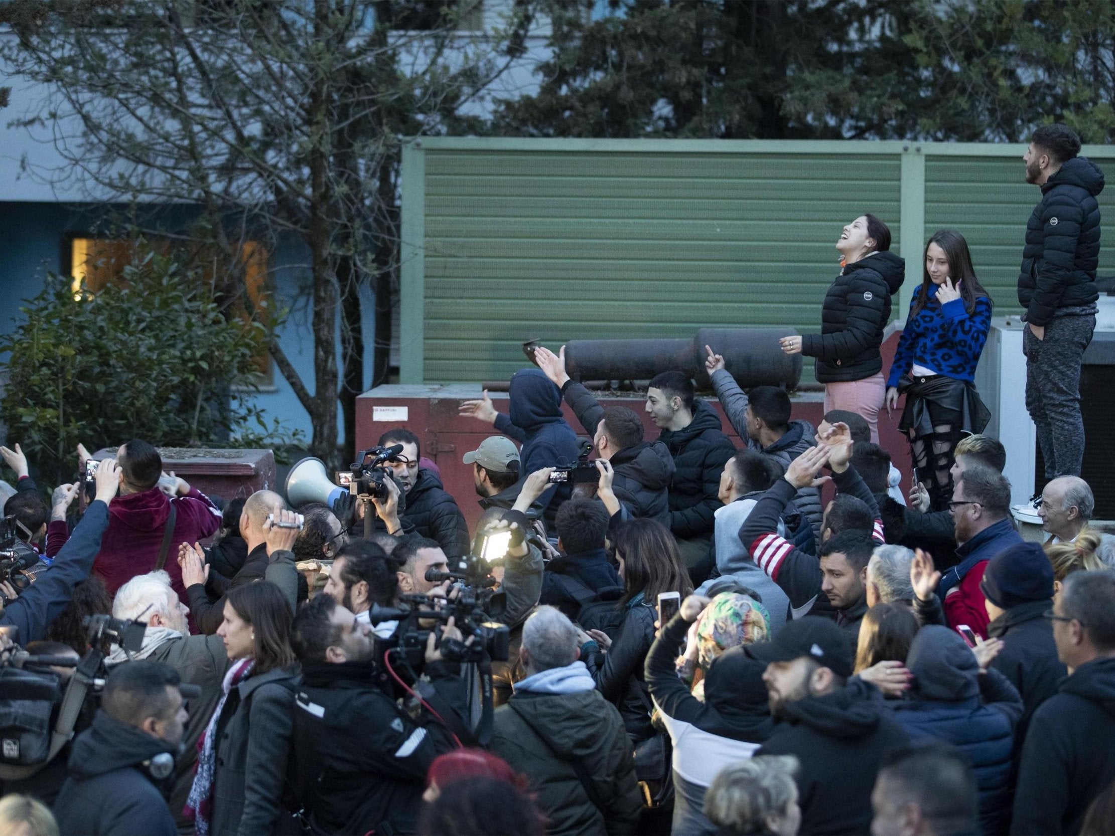 People gather in Rome's Torre Maura suburb during a protest against Roma people arriving at a government-run centre on 3 April 2019;