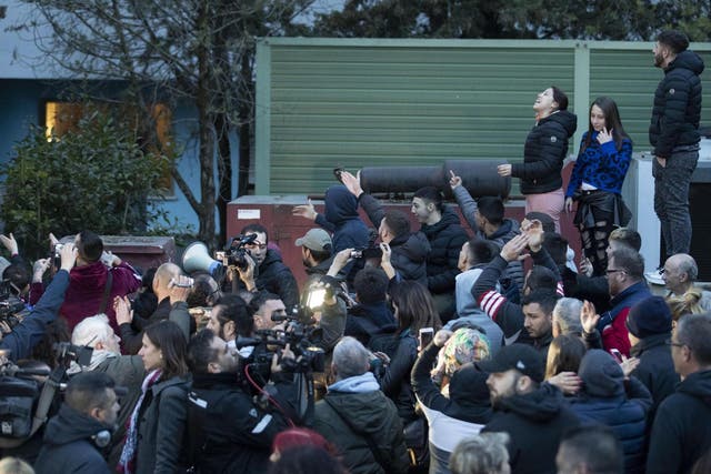 People gather in Rome's Torre Maura suburb during a protest against Roma people arriving at a government-run centre on 3 April 2019;