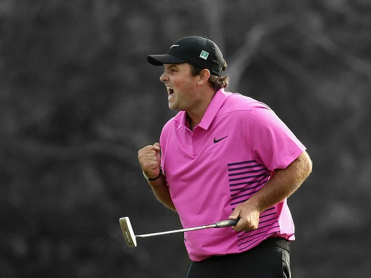 Reed celebrates on the 18th green at Augusta